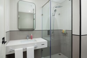 Shower, rainfall showerhead, hair dryer, towels