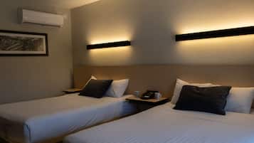 Standard Quadruple Room | In-room safe, desk, laptop workspace, iron/ironing board