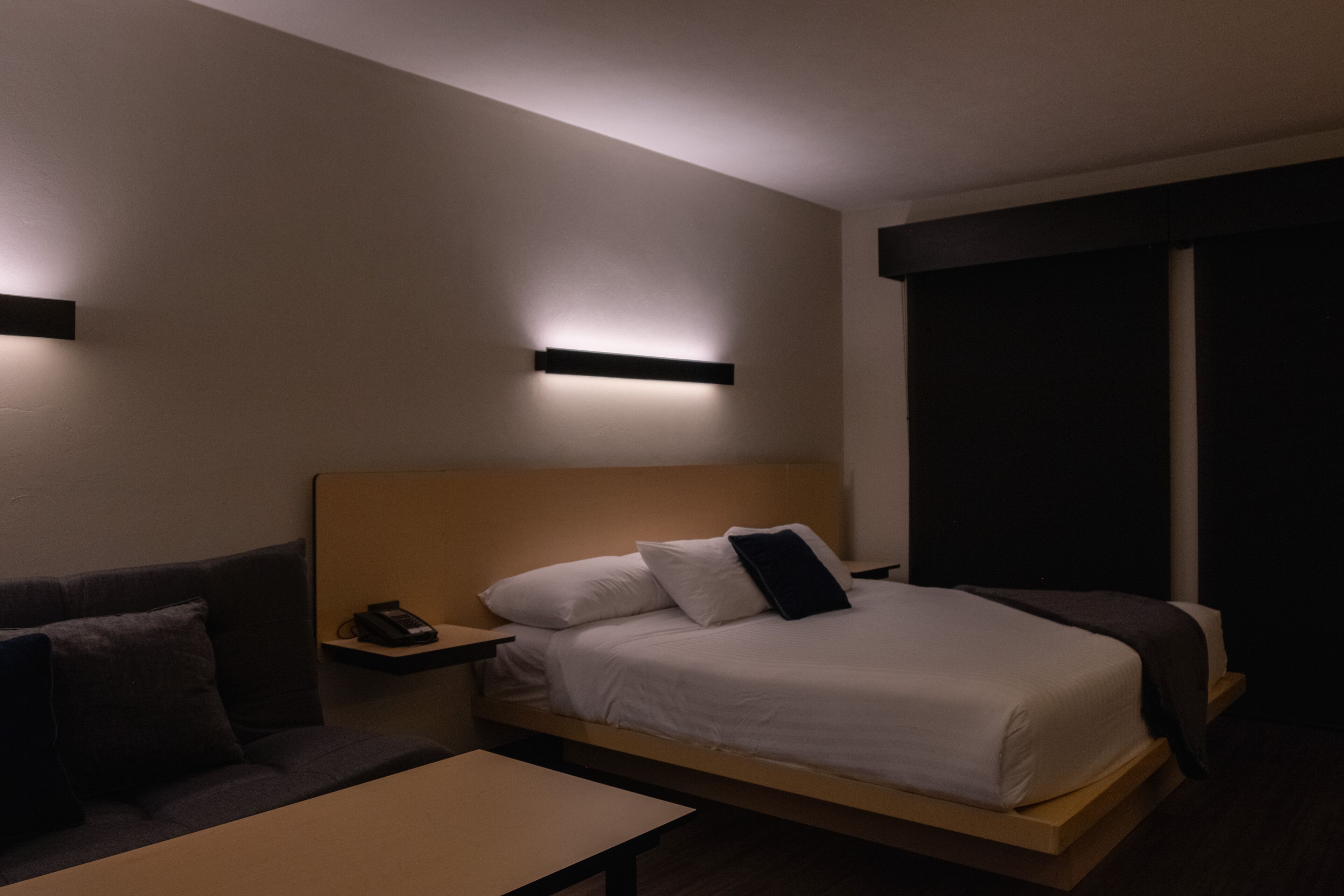 deluxe studio suite | in-room safe, desk, laptop workspace, iron/ironing board