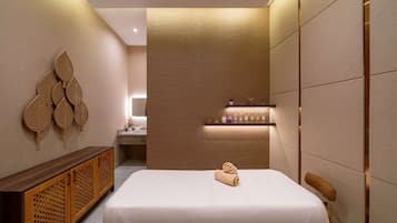Relax in a stylishly designed room with a comfortable bed, console, and ample storage.