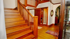 A wooden staircase with a handrail, leading to an upper floor. - Orchard & Mountain Views, 5Mi Wintergreen, Gourmet Kitchen (Massies Mill)