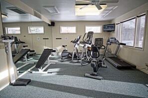 A gym with treadmills, elliptical machines, and a bench. - Storm Meadows Club C-214, King Suite, Club Amenities, Ski In/Out (Steamboat Springs)