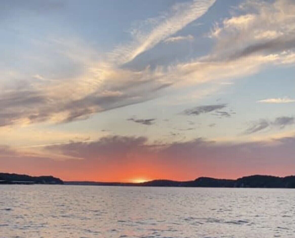 Sunset view picture taken from my boat in the front of the condo’s cove