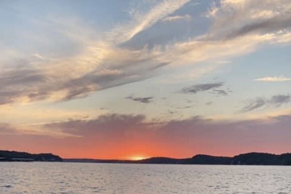 Sunset view picture taken from my boat in the front of the condo’s cove