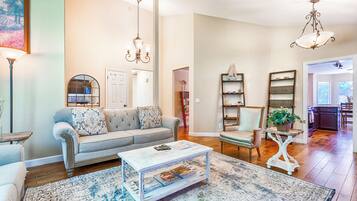 Smart TV, fireplace, books, computer monitors