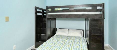 A bunk bed with a lower bed and a ladder.