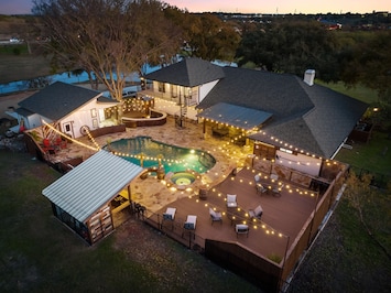 Birds eye view of property at dusk