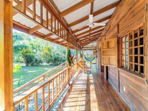 Step out onto the veranda and enjoy the lush garden views.