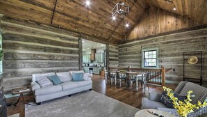 A spacious log cabin interior with a living room, dining area, and kitchen. - ‘Bross Brother's Cabin’ w/ Wraparound Porch! (Cottleville)