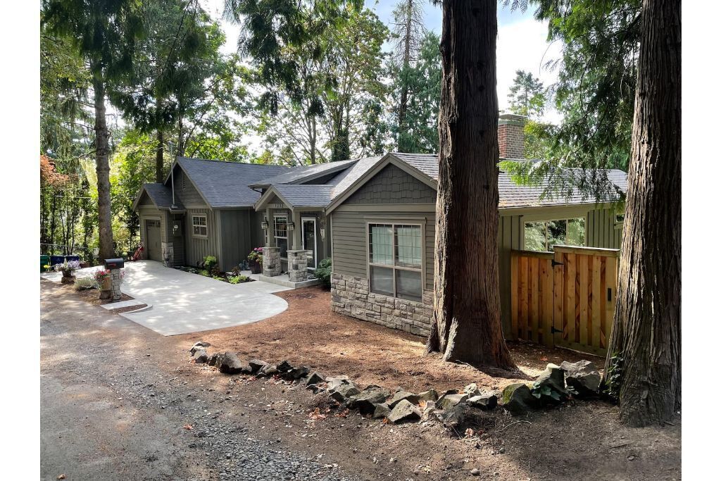 Upscale home in the trees on a hill, yet very close to downtown