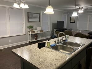 Microwave, dishwasher, coffee/tea maker, cookware/dishes/utensils