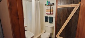 Bathtub, hair dryer, towels