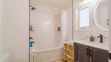 Combined shower/tub, hair dryer, towels, soap