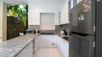 Villa | Private kitchen | Fridge, paper towels
