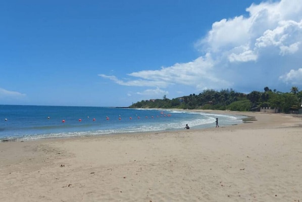 On the beach, sun loungers, beach towels