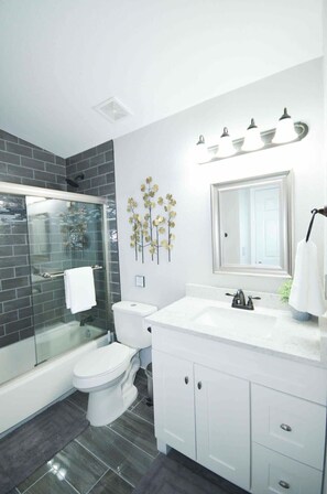 Combined shower/tub, hair dryer, towels, soap