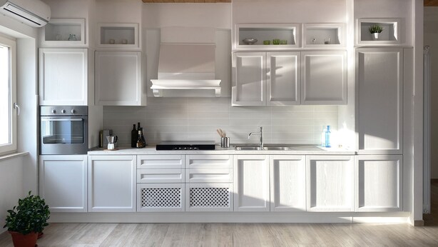 A modern kitchen with white cabinetry, a built-in oven, and a stainless steel sink. - Relais Gregorio - Villa with private pool and garden in Irpinia (Paternopoli)
