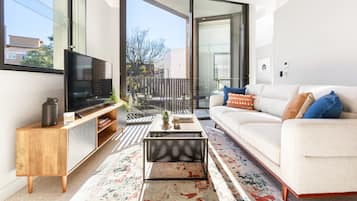 One Bedroom Apartment Open Plan | Living area | 49-inch Smart TV with digital channels, TV