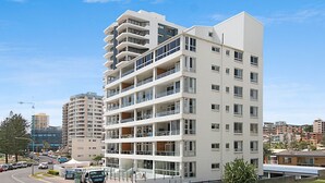 A multi-story hotel with balconies, a modern architectural design, and a view of the surrounding urban area. - Rainbow Pacific Unit 12 - Beachfront unit a great spot for a family beach holiday with Wi-Fi Inc. (Coolangatta)