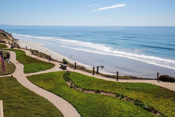 A coastal walkway with a view of the beach and ocean. - Sun, Sand, Vitamin Sea - Walk to Racetrack, Beach, Restaurants (Solana Beach)