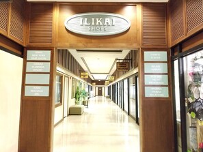 Enter the vibrant ILIKAI SHOPS, offering a range of services and amenities.
