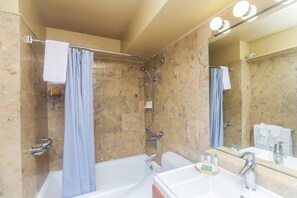 Bathtub, hair dryer, towels