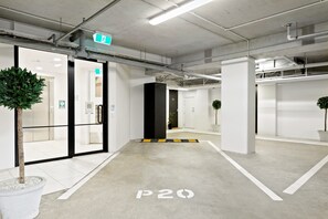 A clean, modern indoor space with a clear floor marking 'P20', white walls, and minimalistic design.