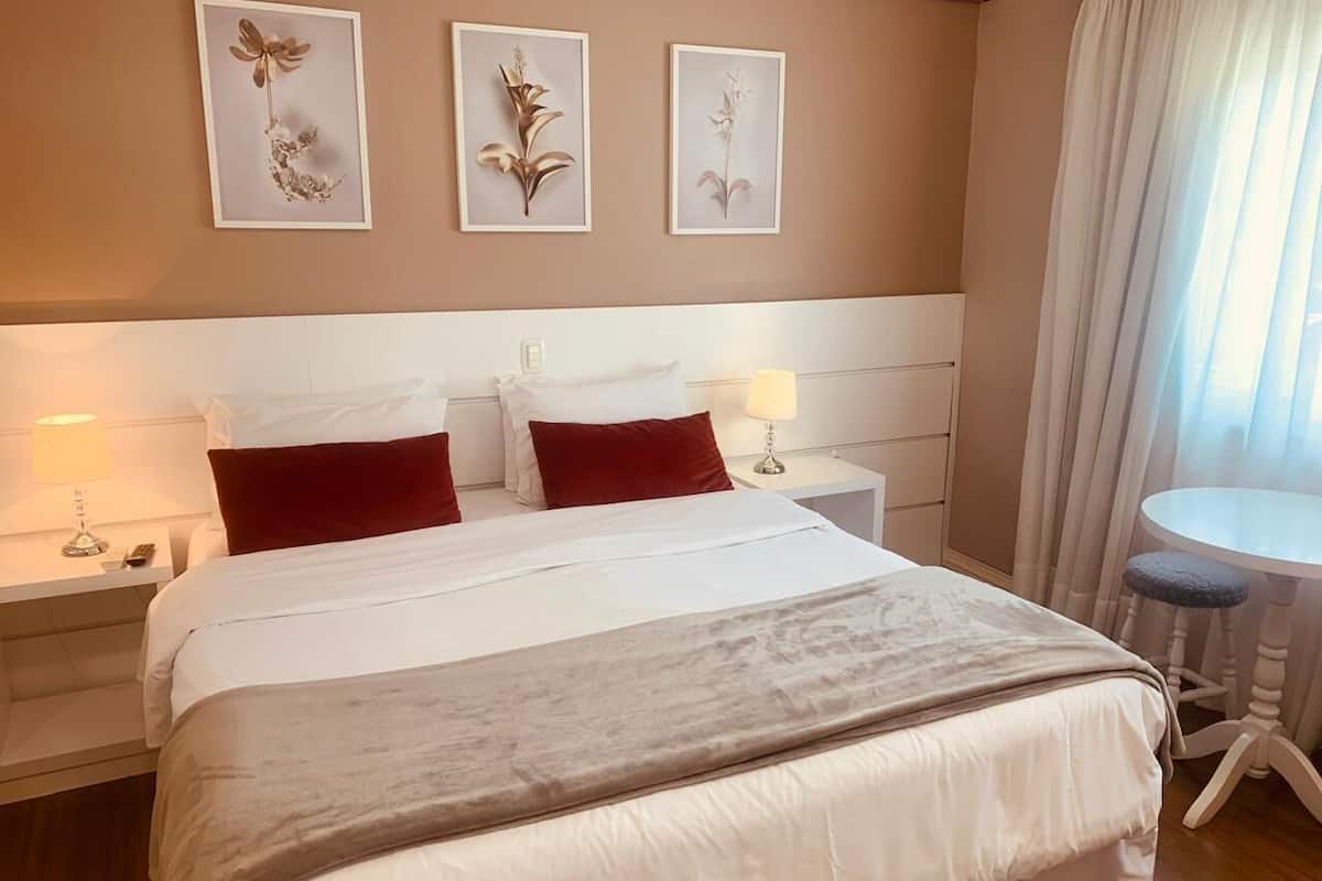 Deluxe Double or Twin Room | Minibar, desk, blackout drapes, soundproofing