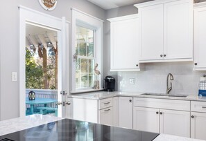 Fridge, dishwasher, coffee/tea maker, cookware/dishes/utensils