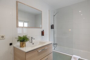 Bathtub, hair dryer, towels