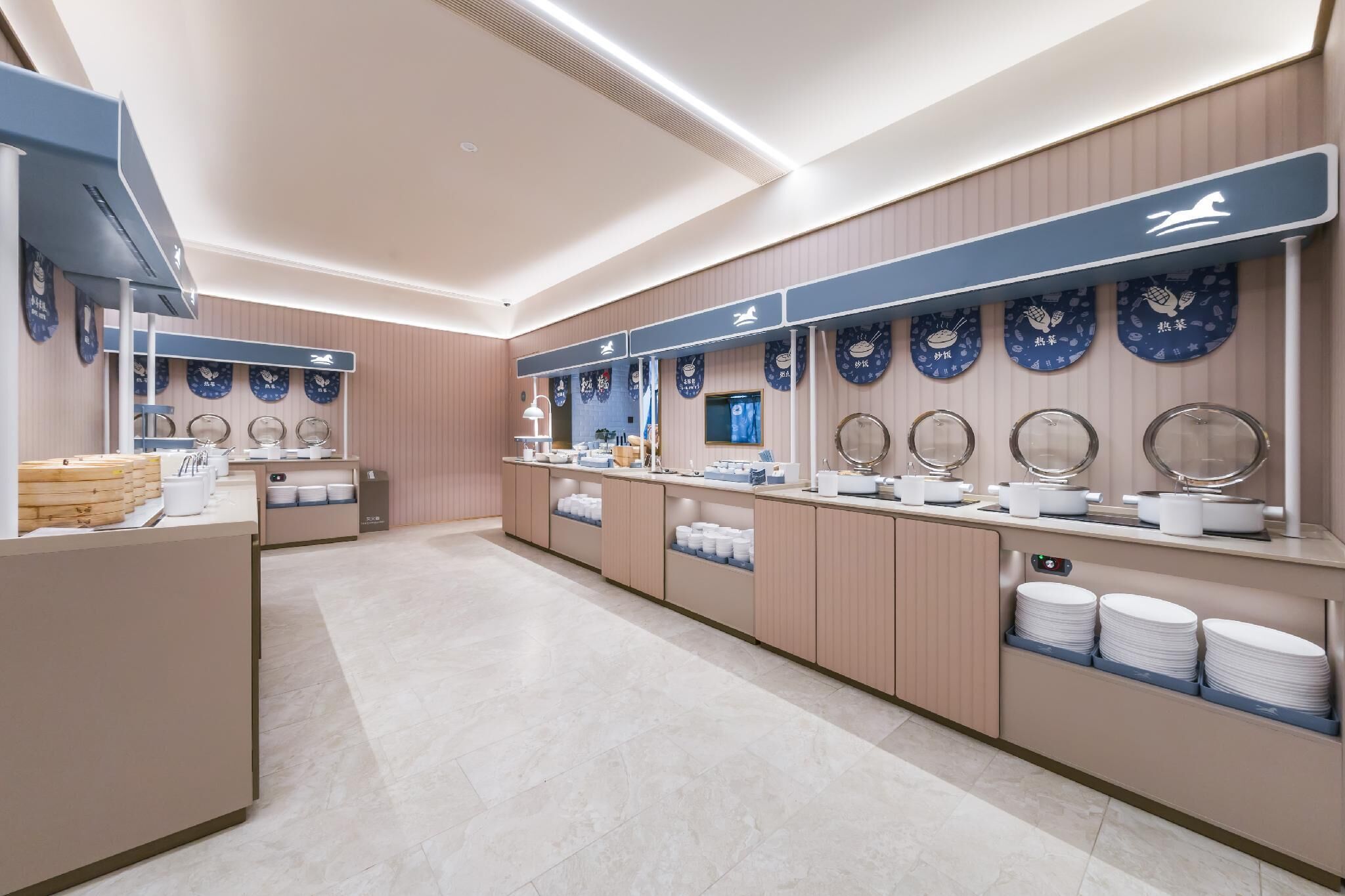 A modern hotel lobby with a long reception desk, wall-mounted clocks, and a blue and white color scheme.