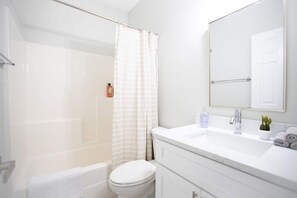 Combined shower/bathtub, hair dryer, towels, soap