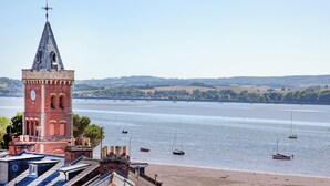 A tower with a clock, a river, boats, and a beach. - 3 bedroom accommodation in Lympstone (Lympstone)