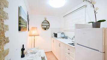 Fridge, microwave, toaster, cookware/dishes/utensils