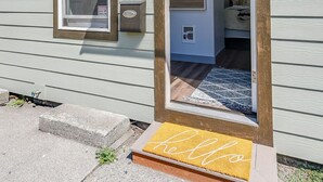 A house with a front door, a window, and a welcome mat. - French Toast Flat (Moscow)