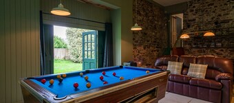 Property looking at Dylan Thomas boat house and Laugharne Castle.