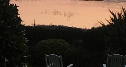 Property looking at Dylan Thomas boat house and Laugharne Castle.