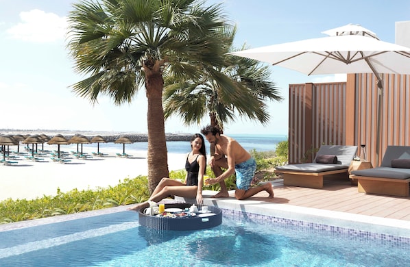 Outdoor pool, open 8:00 AM to 7:00 PM, pool loungers
