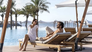 Outdoor pool, open 8:00 AM to 7:00 PM, pool loungers