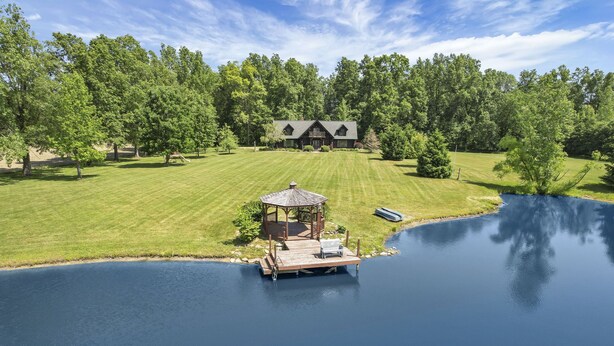 A lakeside property with a dock, a gazebo, and a large house surrounded by trees. - special offers: 20% off all winter bookings,10% discount for early reservations. (Baltimore)