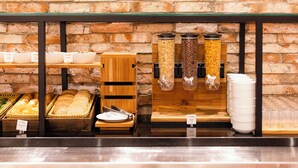 A breakfast buffet with various food items and containers.