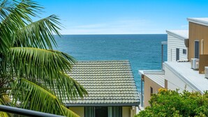 A coastal building with a tiled roof, overlooking the ocean. - Namanula Unit 6 - Ocean Views & Walk to Convent Beach - Holiday Yamba (Yamba)
