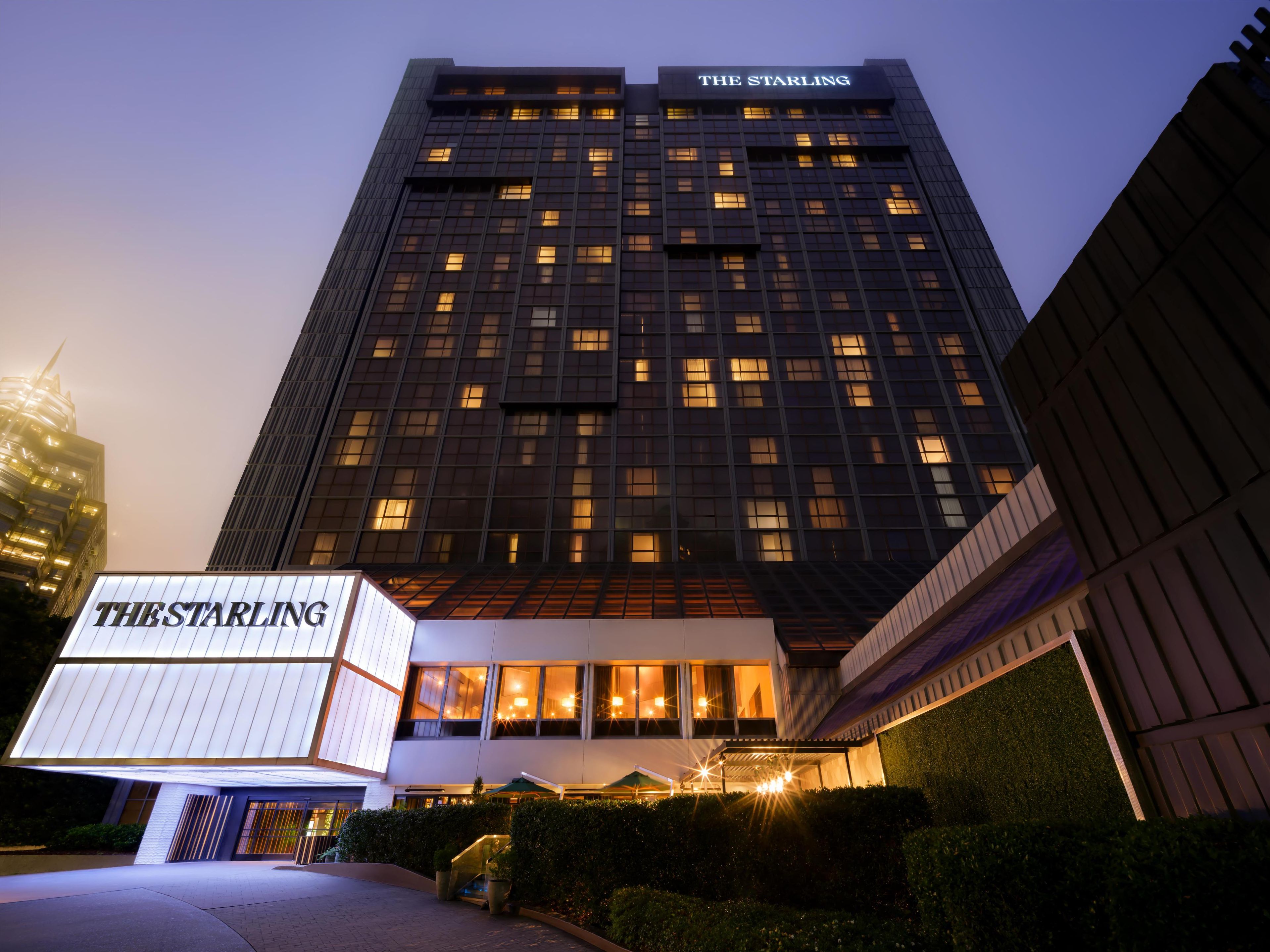 A modern hotel building with a prominent sign reading "THE STARLING" at the entrance.