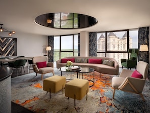 Buckhead Suite | Living area | 55-inch flat-screen TV with cable channels, TV, pay movies