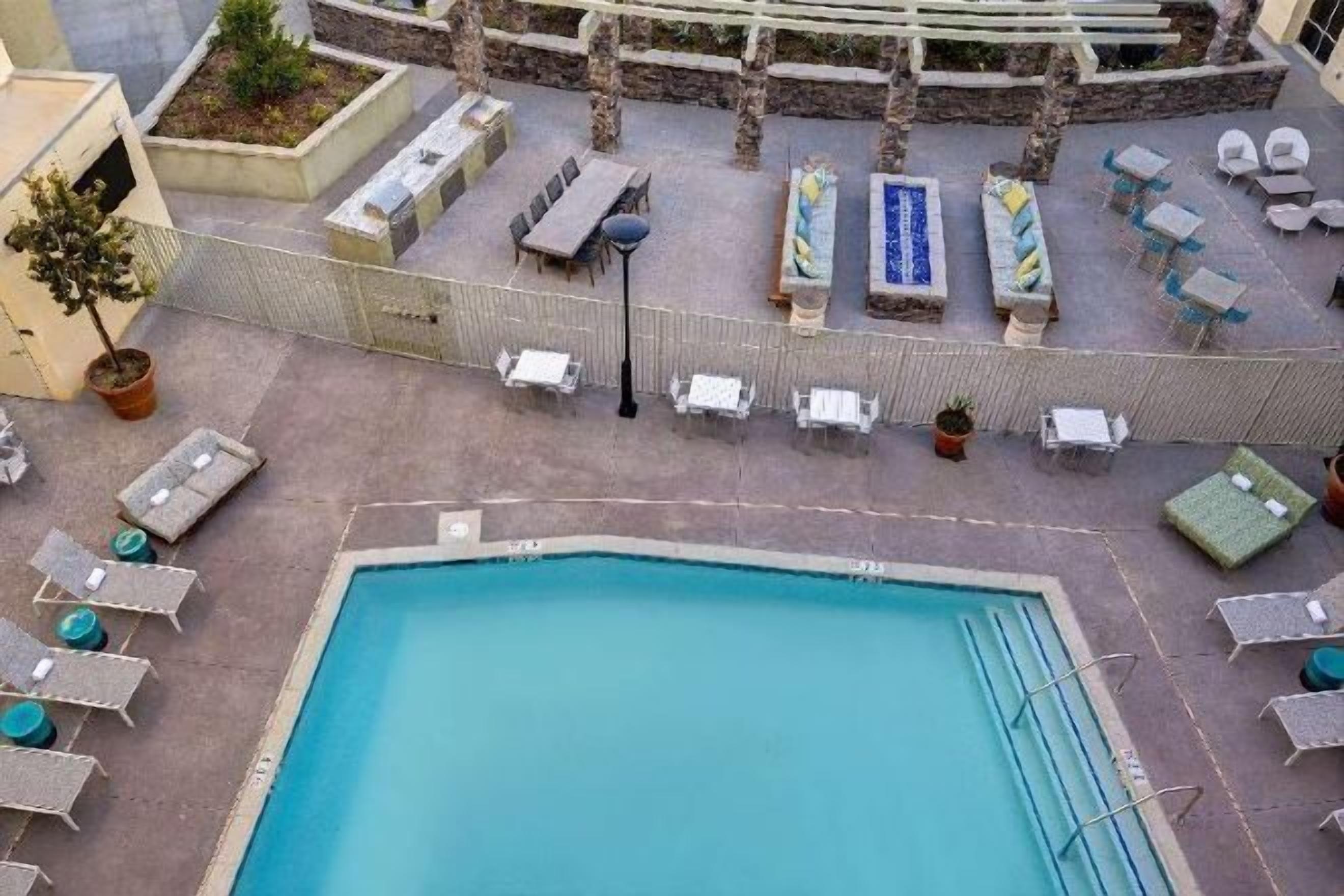 Outdoor pool, open 7:00 AM to 10:00 PM, sun loungers