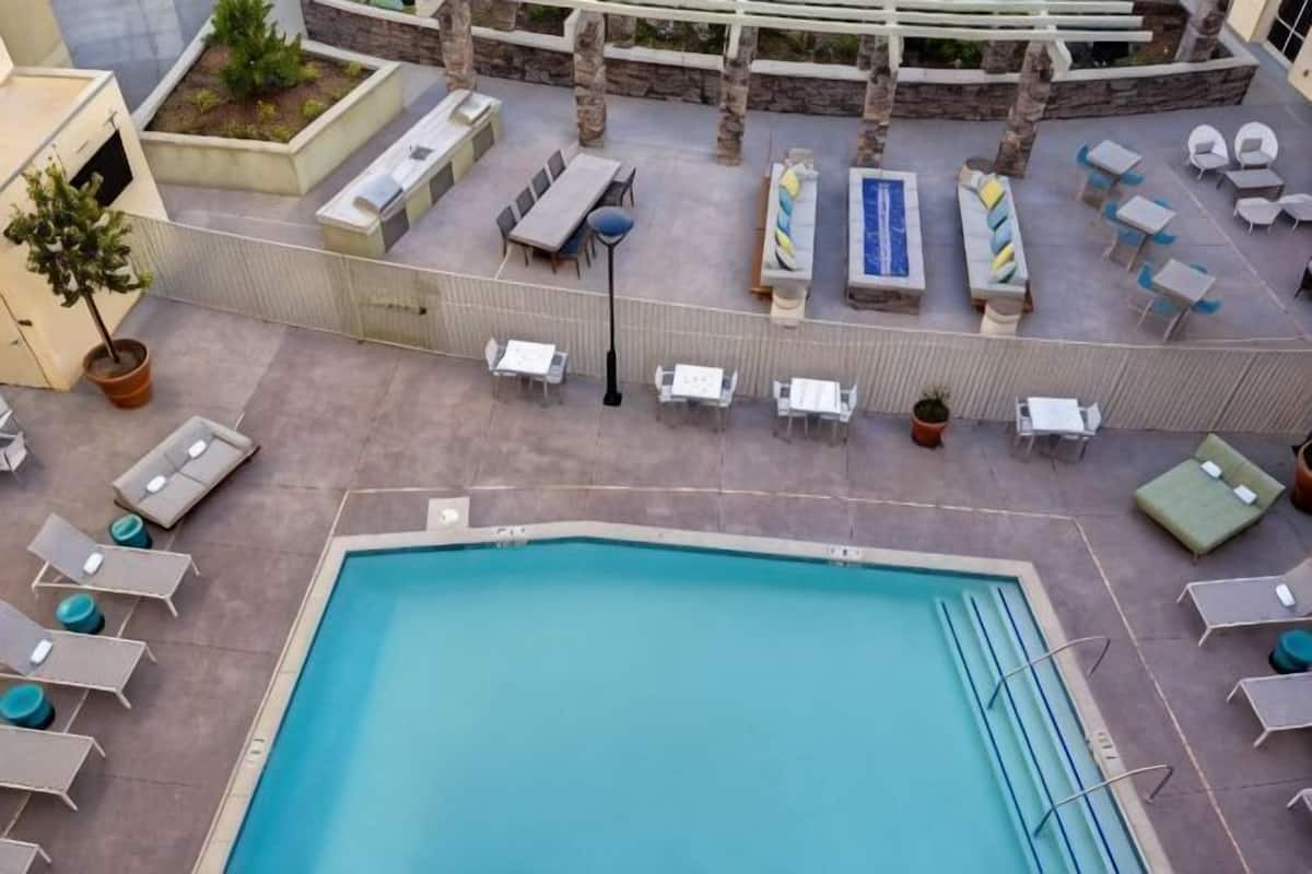 Outdoor pool, open 7:00 AM to 10:00 PM, sun loungers