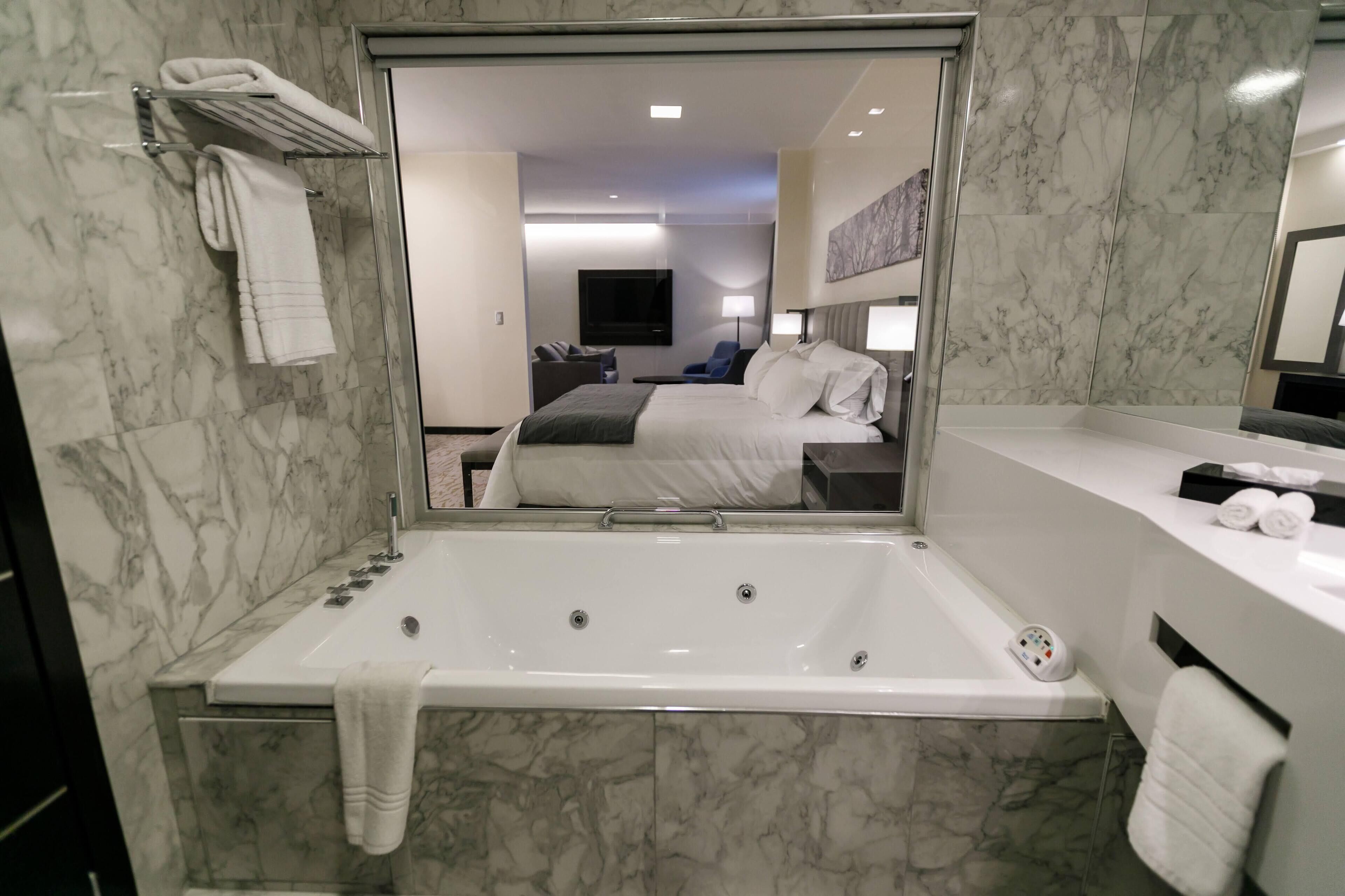 separate bathtub and shower, jetted bath, rainfall showerhead