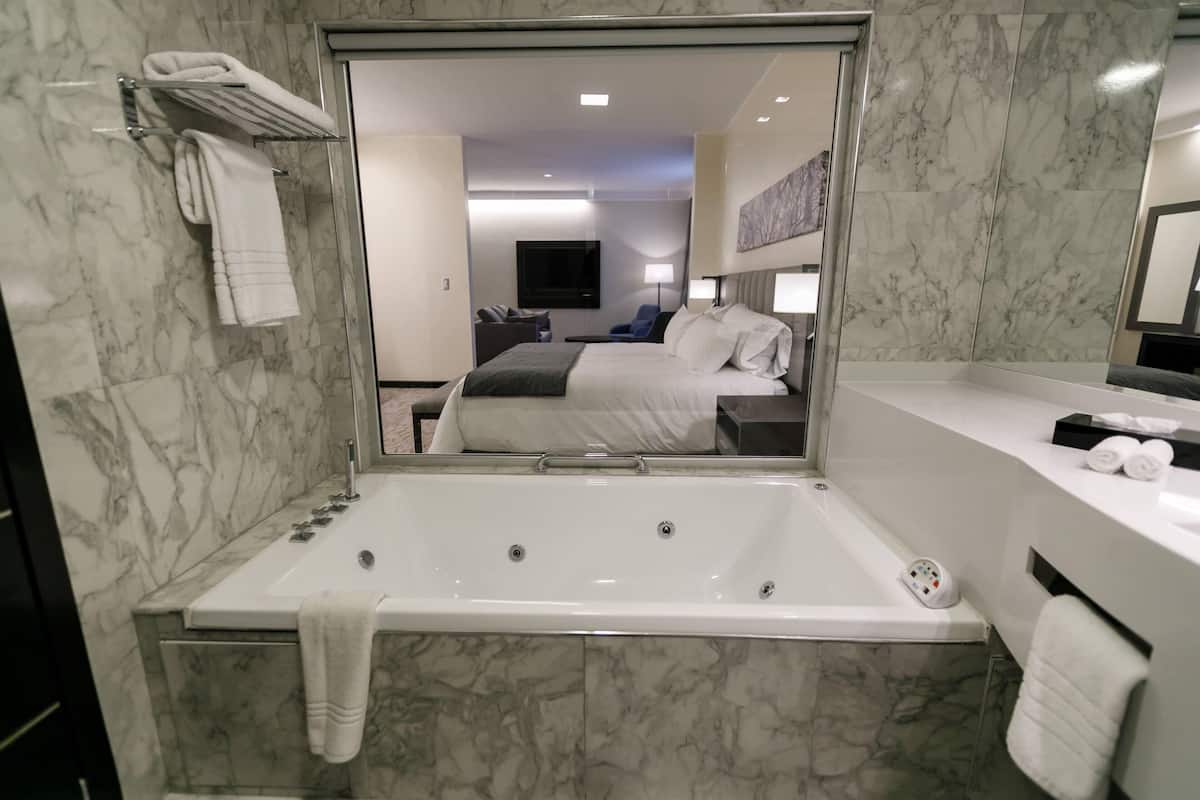 separate bathtub and shower, jetted bath, rainfall showerhead