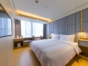 A modern hotel room with a large bed, bedside tables, a window with curtains, and a built-in headboard. - JI Hotel (Hangzhou West Lake Hubin Jiefang Road) (Hangzhou)