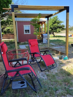 Property grounds - Cozy Tiny Cabin with a small porch and firepit. (Kempner)